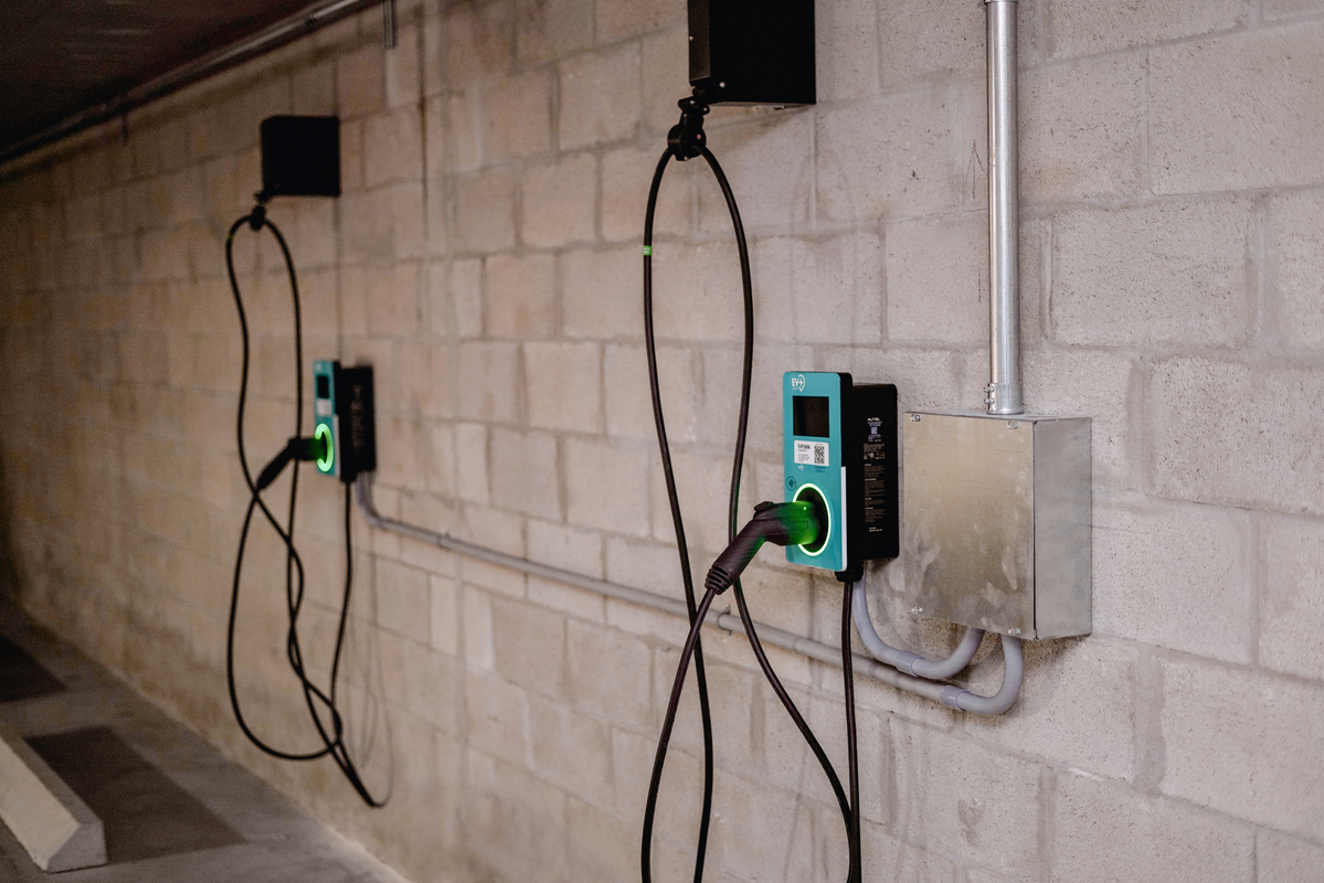 Level 2 EV chargers installed in a commercial property parking garage